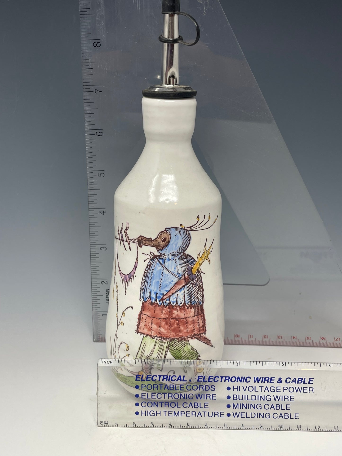 Red & Blue Bird Roost oil bottle