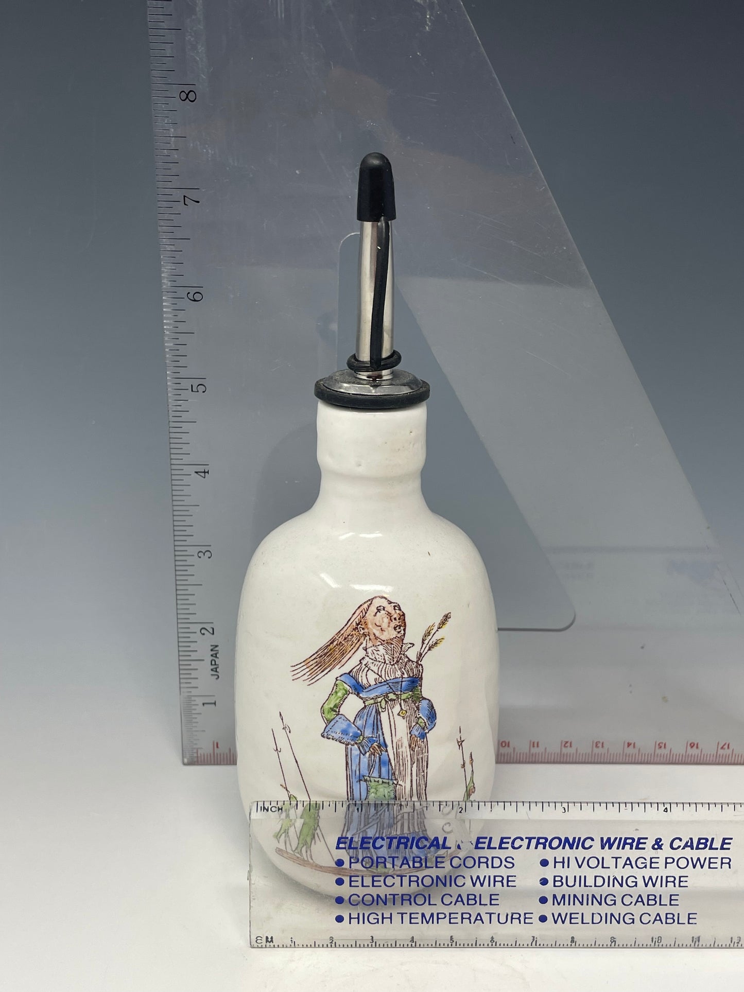 Escorted lady in blue & green oil bottle